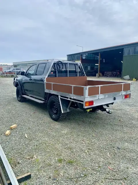 Custom flat deck on ute with timber decking and steel sides