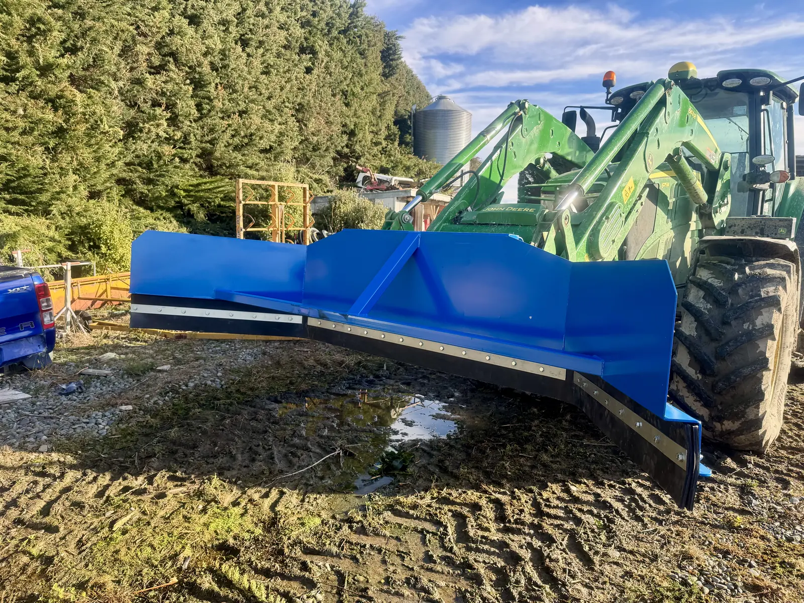 Yard scraper fitted to a tractor front-end loader on a Southland farm